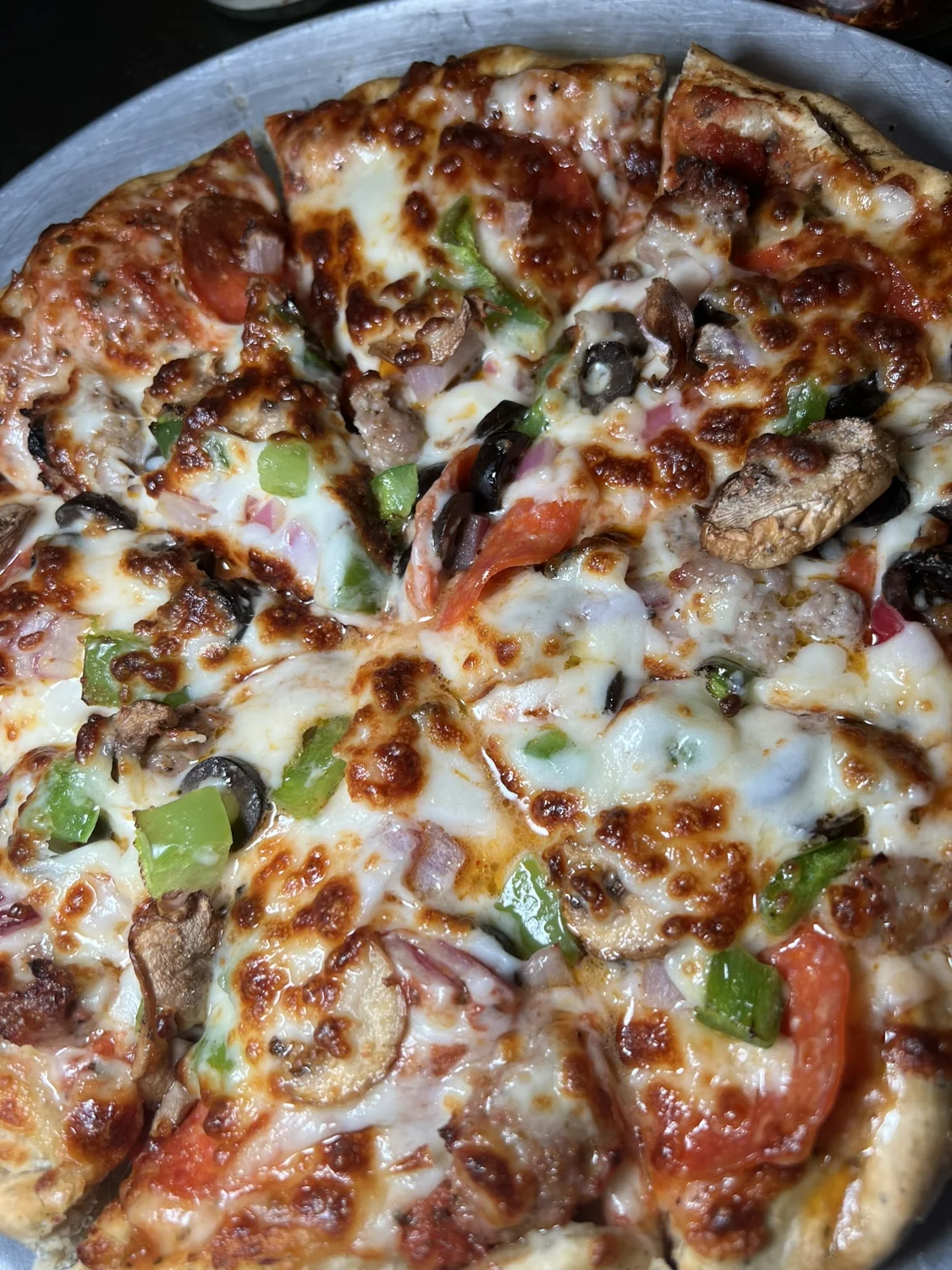 Turtle Bay combo pizza with pepperoni, sausage, and vegetables